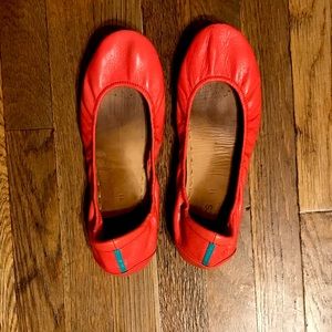 Tieks in poppy. Soles are in great condition with minor marks on the heels